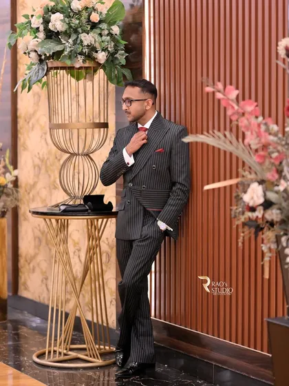 Mr. Basrah in his tailored pinstripe double-breasted suit, a perfect choice for a formal event.