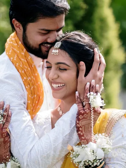 The pure bliss of a Haldi ceremony. This joyful embrace shows the fun and love that fills the air during pre-wedding festivities.