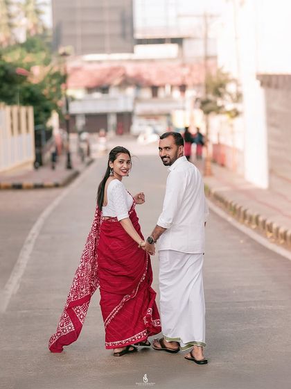 A classic "follow me" shot down a city lane, capturing a moment of connection and movement.