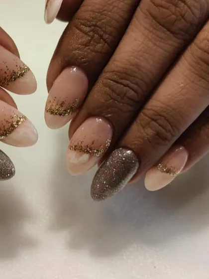 A close-up of this beautiful wedding season design, showing the delicate gold glitter fade and the sparkling silver accent nail.