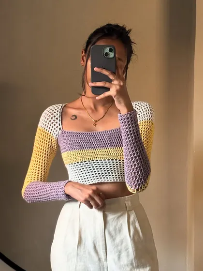 Another angle of the pastel color-block top. The mesh sleeves keep it light and airy, while the main body provides more coverage.