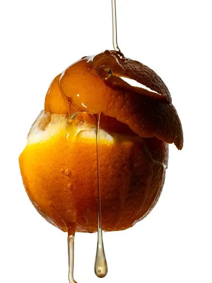 In this shot, I explored texture by peeling an orange and letting honey drip over it. The interplay of the rough peel, the juicy fruit, and the smooth liquid creates a complex and interesting still life.