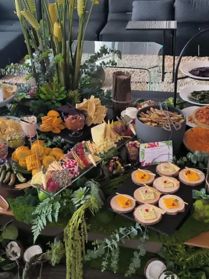 A lush and abundant grazing table, showcasing another of our service styles. Grazing tables are perfect for creating a relaxed, communal, and visually impressive focal point for an event.
