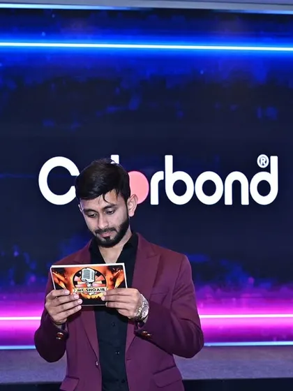 Preparation is everything. Here I am reviewing my cue cards backstage at the Colorbond and Tata Bluescope Steel event to ensure a flawless and polished presentation.