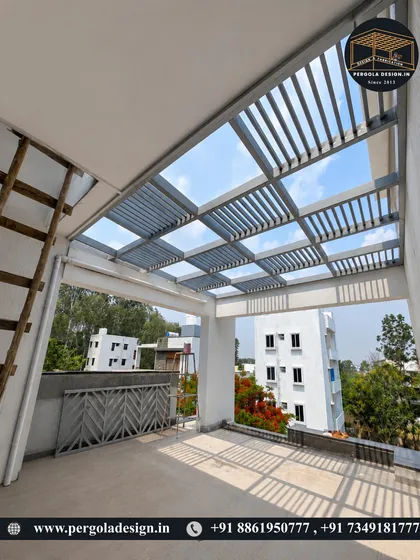 This image highlights the interplay of light and shadow created by the louvered pergola roof. The design is not just functional but also adds a dynamic visual element to the outdoor space throughout the day.