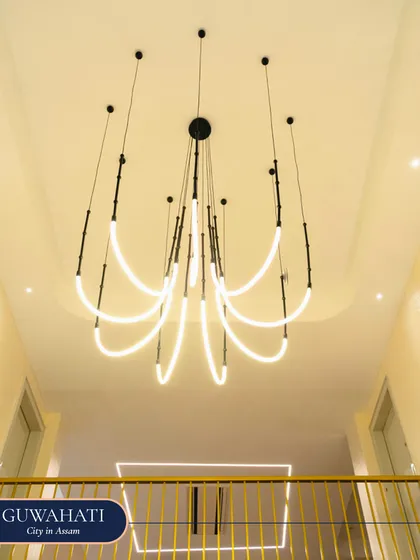 This dramatic, modern LED chandelier was installed in the entryway of the Guwahati home. Its sculptural form creates a grand first impression, showcasing tailored brilliance and a signature lighting transformation.