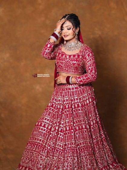 This pose captures the elegance of the bride's hairstyle and the intricate work on her lehenga. The soft tendrils framing her face add a touch of romance.