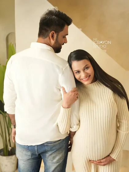 A sweet and simple pose in my warm, minimalist studio. Her smile as she leans on his shoulder shows the comfort and security of their relationship.