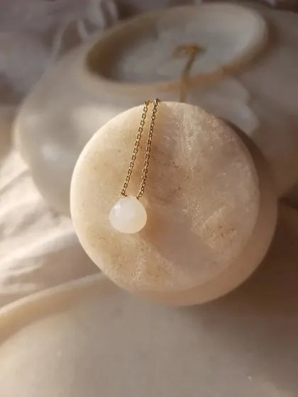 A closer look at my 'Badamcha' heart-shaped drop pendants. The white moonstone is for inner growth, while the green chrysoprase promotes love of truth.