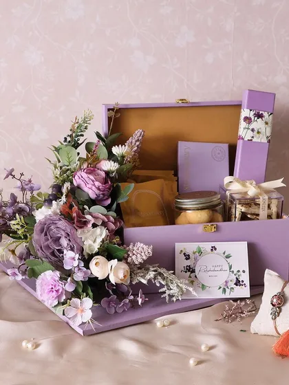 A touch of lavender, a world of elegance. This Rakhi hamper includes chocolate truffles, a Very Berry chocolate bar, almond cookies, and fudge brownies.