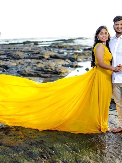 Brighten up your photoshoot with this vibrant yellow long-tail gown. The cheerful color looks incredible against natural backdrops like this rocky shoreline.
