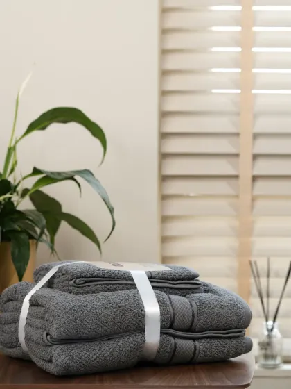 A set of grey towels, part of the same product line. Our systematic approach ensures all color options are represented beautifully.