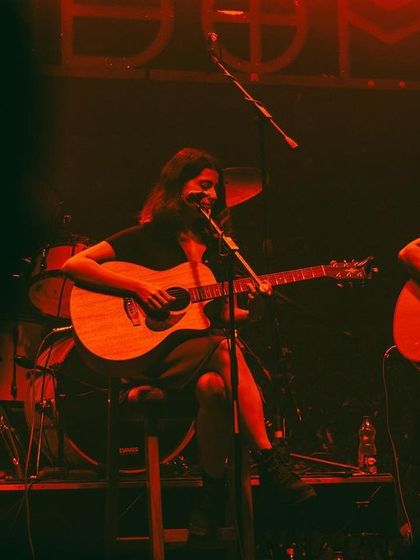 A view from the audience, capturing the warm, red-lit ambiance of our trio gig.