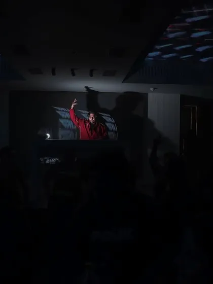 Another wide shot from the crowd's perspective, showing me commanding the stage under the lights.