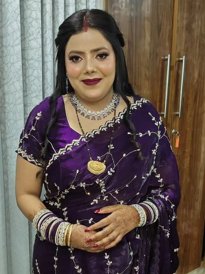 A full view of the purple-themed makeup look. The glittery eyes and glossy lips create a stunning, cohesive look.