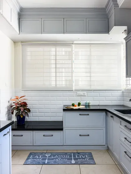 In this kitchen, I created a small, multifunctional nook with a bench seat. It's the perfect spot to have a morning coffee or take a short break while cooking.