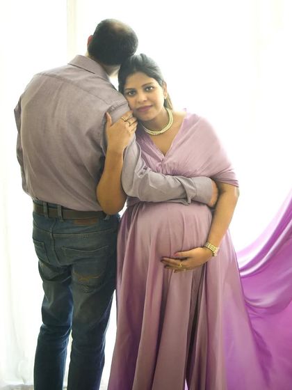 A loving embrace from behind. This pose is intimate and sweet, showing the support and love of the partner.