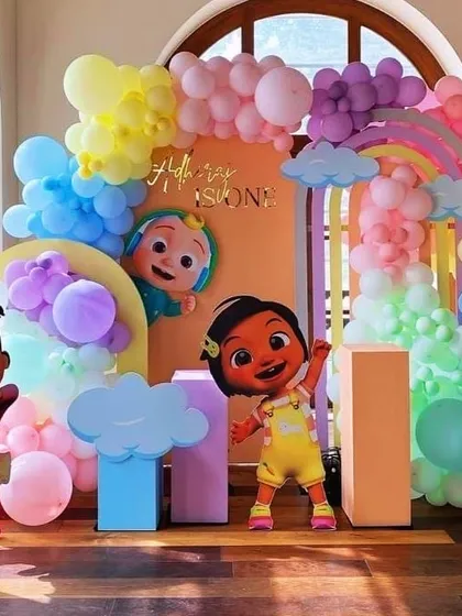 We bring the world of Cocomelon to life with vibrant colors and beloved characters. This setup for Adhrish's first birthday features a full cast of character cutouts, a rainbow balloon arch, and multiple themed backdrops to create a truly immersive and playful environment for the little ones.