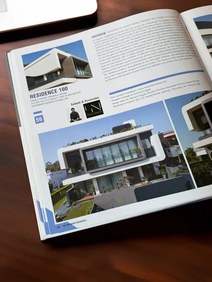 A look inside the "101 Top Indian Residences" book, where Residence 100 is featured for its unique contemporary design.