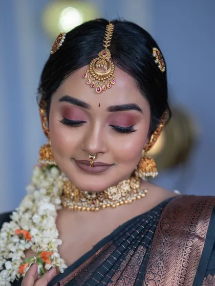 A close-up of the eye makeup from the airbrush demo, showing a soft pink and brown blend.