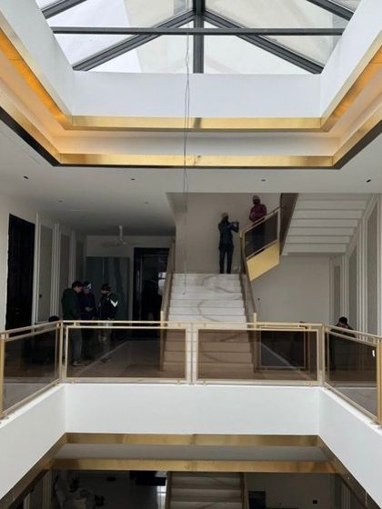 A glimpse of our architectural work in progress. This double-height space with its grand staircase and skylight is taking shape, showcasing the structural planning and attention to natural light that are central to our design philosophy.