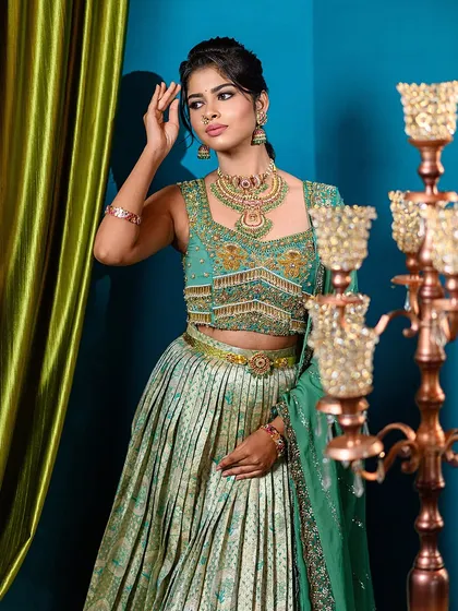 A full-frame shot of the semi-traditional engagement look. The model is posed next to a large candelabra prop, showing how we can use set pieces to enhance even close-up shots.