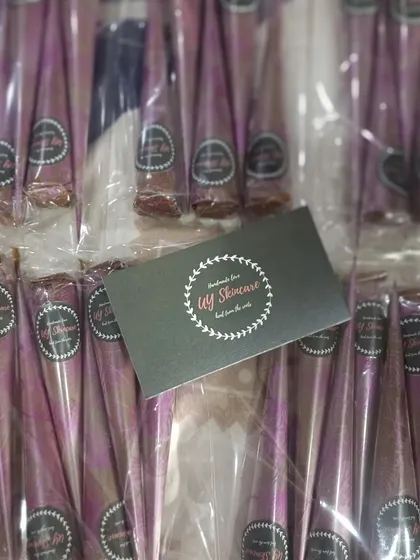 Freshly packed organic henna cones in their signature purple wrapping. Each pack is sealed to maintain freshness until it reaches you.