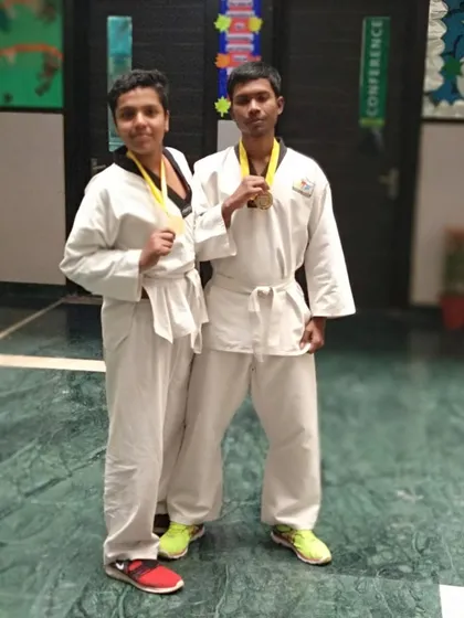 Two of our gold medalists after a successful competition. The real prize is the discipline they learned along the way, but the medals are a great reminder of their achievement.