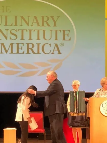 Another photo from my graduation day. This moment was the culmination of years of hard work and the beginning of my professional journey as a chef.