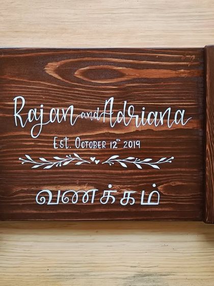 This rectangular cheese board, personalized for "Rajan and Adriana," includes their anniversary date and a "Vanakkam" greeting, making it a meaningful and functional gift.
