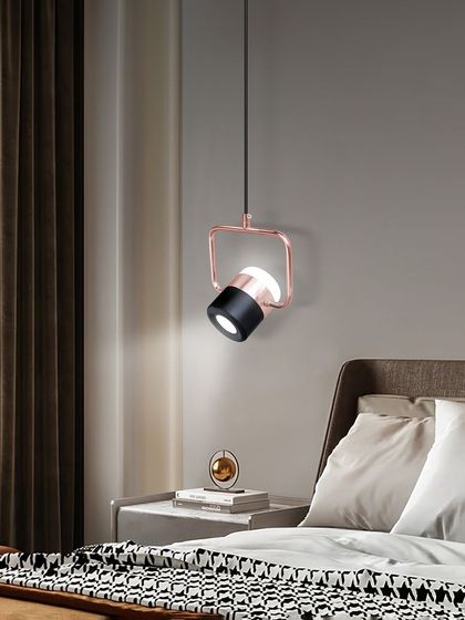 This adjustable spotlight pendant is perfect as a bedside reading light. You can direct the light exactly where you need it. The rose gold and black finish is very modern and stylish.