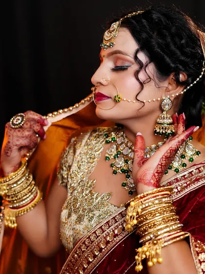 A side profile of another bridal look, showing the elegant hairstyle and how the makeup enhances the bride's features from every angle.