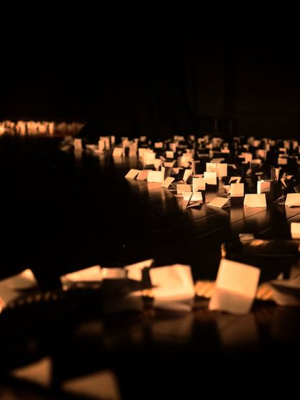 The stage for "Gretel," littered with paper, creating a unique and imaginative set.