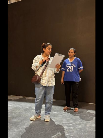 A team huddle backstage to review the show script during the TAFE conference. Collaboration is key to our success.