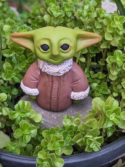 May the force be with you. This Baby Yoda is handcrafted from polymer clay and makes the perfect desk buddy for any Star Wars fan.