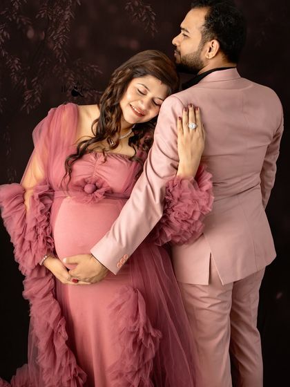 The way she rests her head on his shoulder says everything. I aim to capture these small gestures of love and support that define a couple's journey to parenthood.