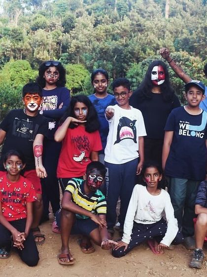 The "wild bunch" poses for a group photo with their creative animal-themed face paint.