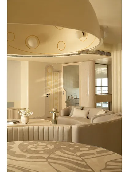 We see dining tables as centerpieces for stories and meals. This piece features a custom marble inlay top with sinuous patterns inspired by illustrator Jane Foster, crafted from Crema Marfil and Federal Beige marble. It’s paired with a fluted banquette, creating an intimate and artistic dining nook.