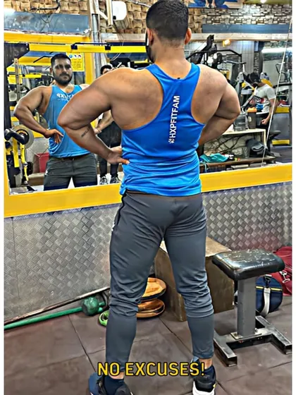 No excuses. Even on days you don't feel like it, getting the work done is what separates good from great. Here I am checking my back progress in the mirror.