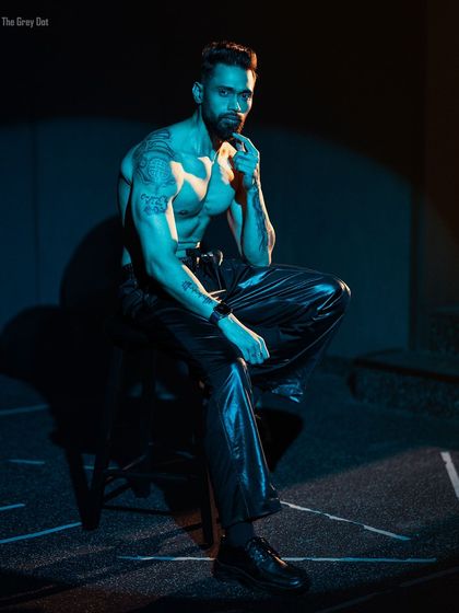 A stylish photo of me with the caption explaining that my physique journey was never about bodybuilding, but about becoming stronger than the weak kid I used to be.