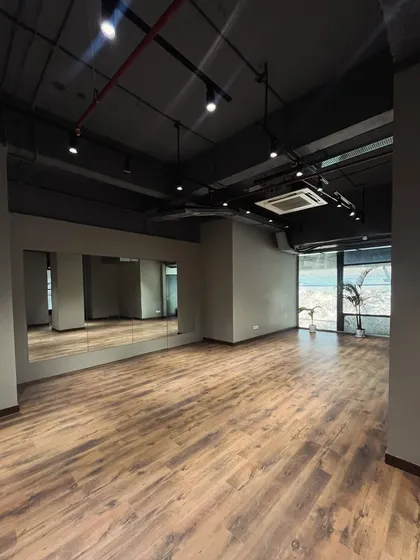 Our wall-to-wall mirrors are essential for perfecting your craft. I made sure they were a key feature, so you can check your choreography, monitor your form during a workout, or get that perfect group shot. The reflection helps create a sense of a larger, more energetic space.