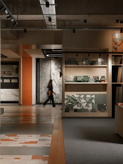 The main circulation spine of the Trove experience centre. The layout is designed for easy navigation, with layered displays and open shelving that showcase materials like art objects.