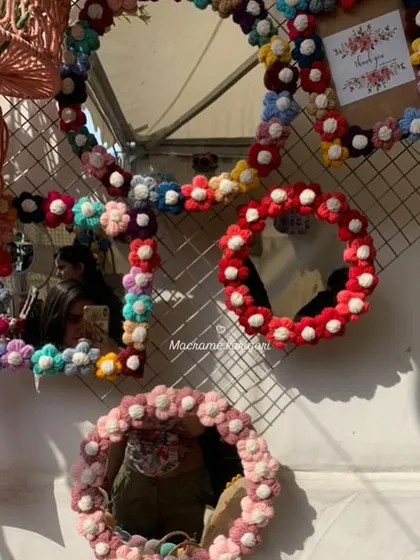 Our handmade crochet mirrors are more than just for reflection; they are pieces of art. This round mirror is framed with a border of delicate, multi-colored crochet flowers, adding a unique and playful touch to your wall decor.