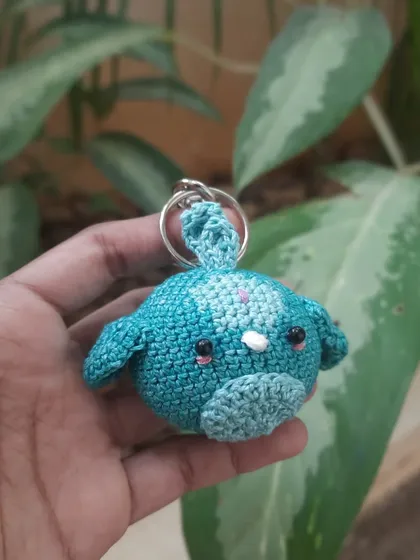 A cute little blue bird or fish amigurumi. The variegated yarn gives it a lovely, multi-toned effect, and the blush makes it extra sweet.