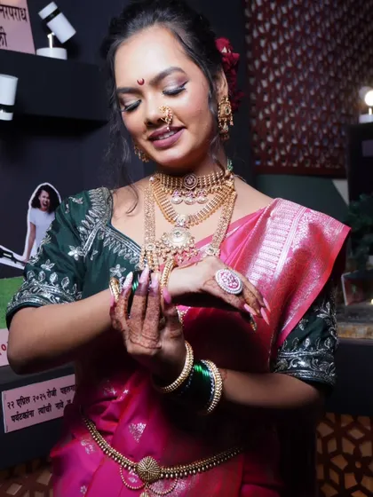 Here I am in a traditional Marathi look for Ganesh Utsav. I believe your nails are the final touch to any festive outfit, and I’m wearing a custom set of extensions with delicate art that complements the entire look.