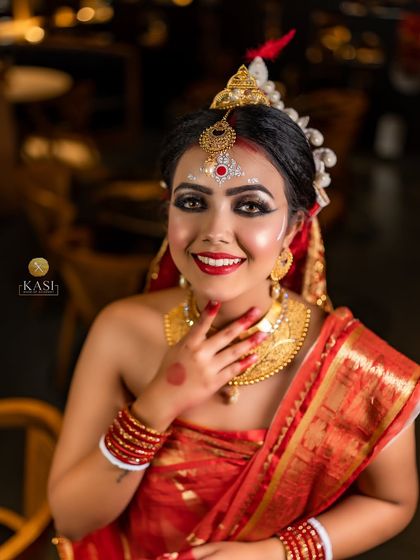 A complete view of the Bengali bridal style, from the mukut (headpiece) to the gold jewelry. I take great care in understanding and recreating these culturally rich looks for my clients.