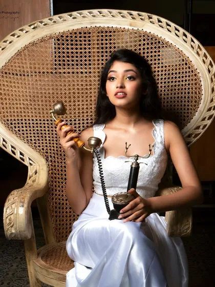 A fun, retro-themed shot with actress Rachana Inder. We used a vintage telephone prop and a classic peacock chair to build a specific mood. Concept shoots like this are a collaborative effort to bring a creative vision to life.
