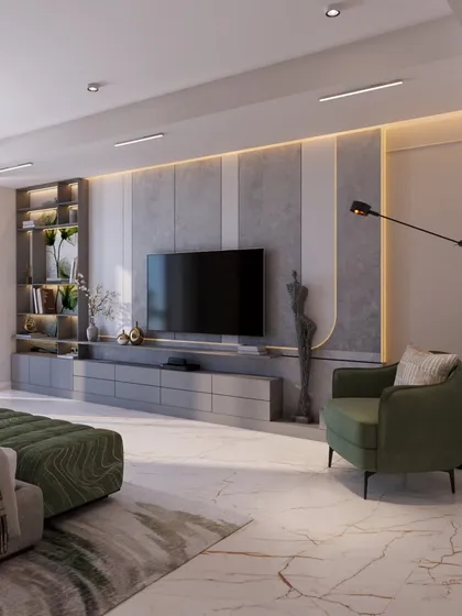 The TV wall in this bedroom is a composition of textures, with concrete-finish panels and integrated shelving. The green armchair creates a cozy reading nook.