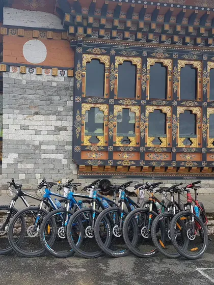A lineup of our mountain bikes against the beautiful, traditional architecture of Bhutan. We make sure you have the right gear for the adventure.