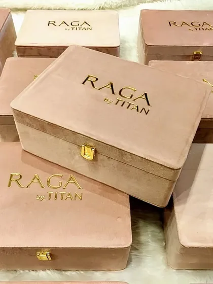 An array of the beautiful pastel pink suede watch boxes I created for Titan Raga. The consistent branding and high-quality finish demonstrate my capability in producing elegant, large-scale product packaging.